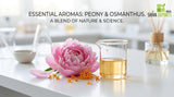 A macro photograph of pink peony petals and orange osmanthus flowers resting on a clean, white laboratory workbench next to a small glass beaker filled with clear golden oil