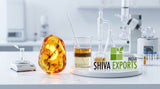 Close-up of amber resin glowing next to modern glassware on a clean white laboratory bench, soft clinical lighting, professional chemistry setting