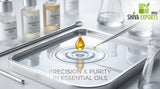 macro photograph of a single drop of golden liquid falling into a pool of clear water, creating ripples, clean laboratory background, soft studio lighting, silver and white accents